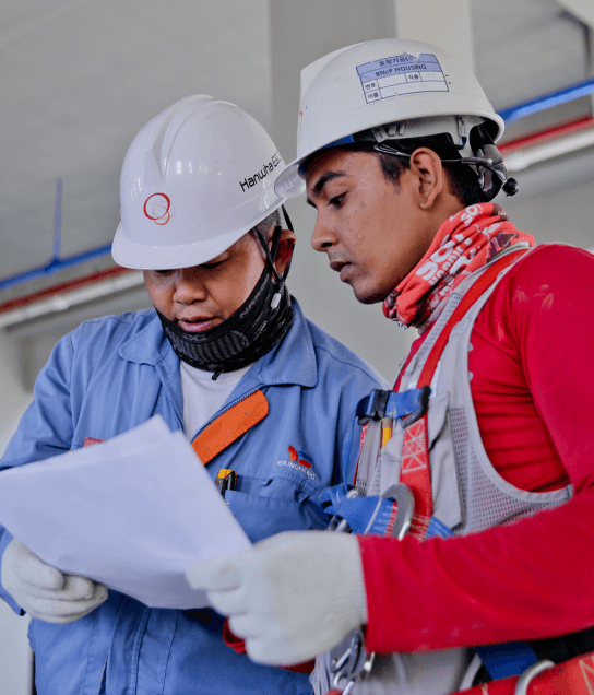 Workers reading translated documents in Houston. 
